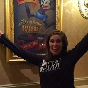 Women excited by poster at Disneyland