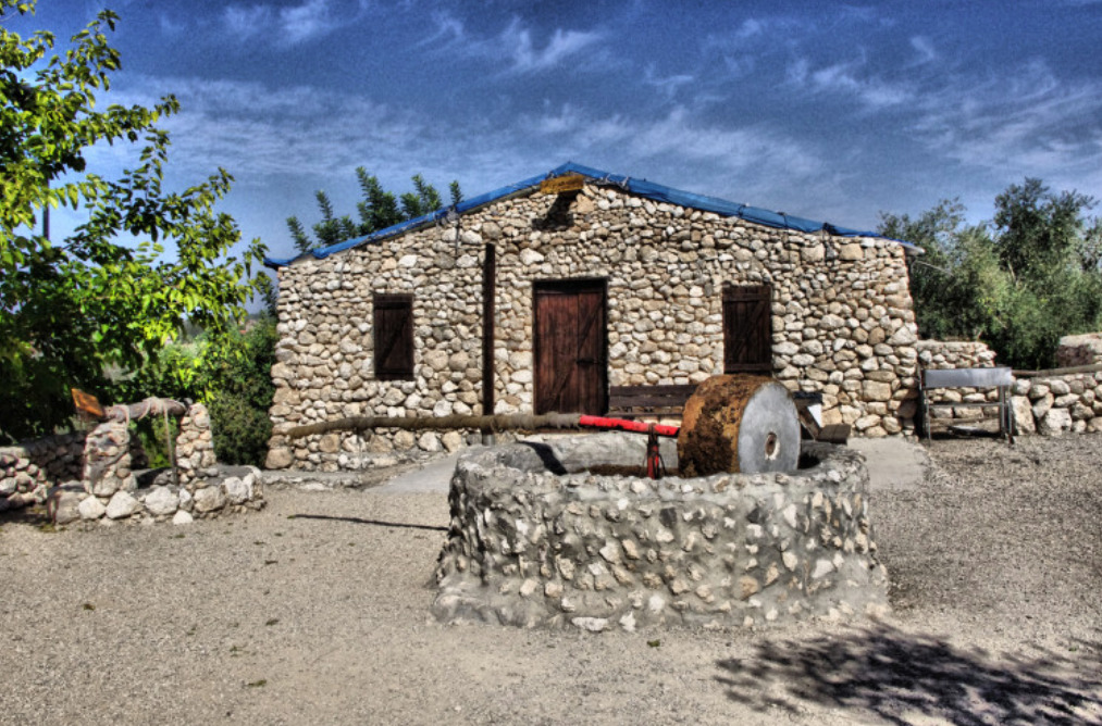 Stone building, well, and olive press